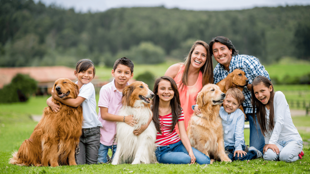 Happy family with their pets at home – showcasing pet breeds for PetCastel and inspiring families to adopt a dog in USA for the perfect companion.