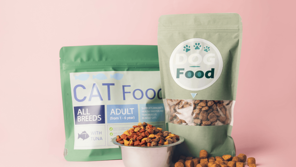 PetCastel pet food – nutritious dry kibble shaped in a paw design with hands around it, symbolizing healthy pet nutrition and care.